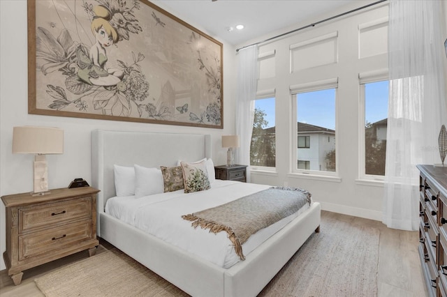 bedroom with light hardwood / wood-style floors