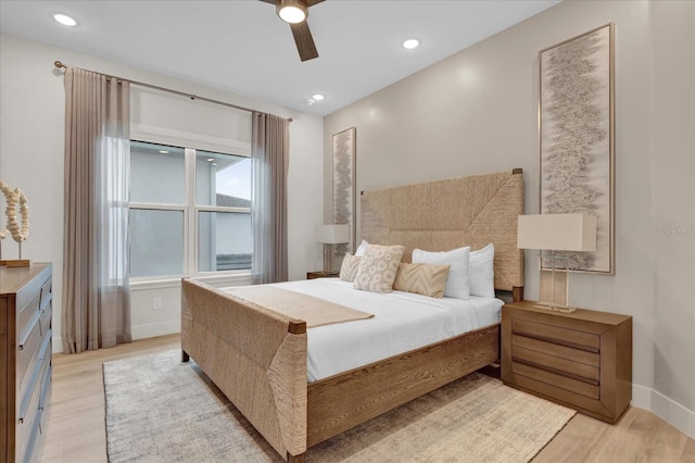 bedroom featuring light hardwood / wood-style flooring and ceiling fan