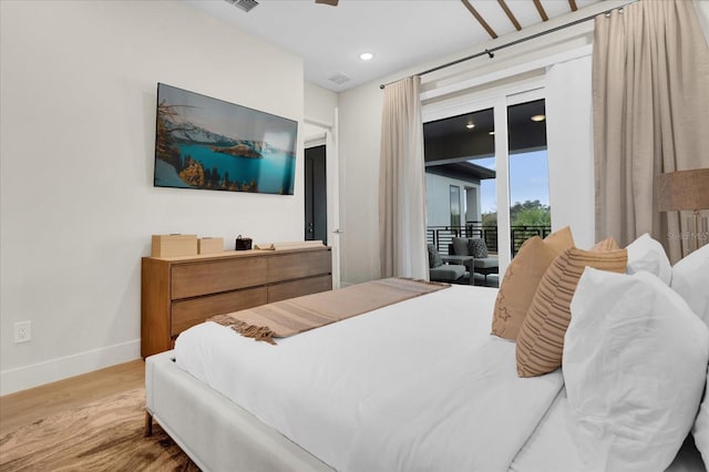 bedroom featuring access to outside and light wood-type flooring