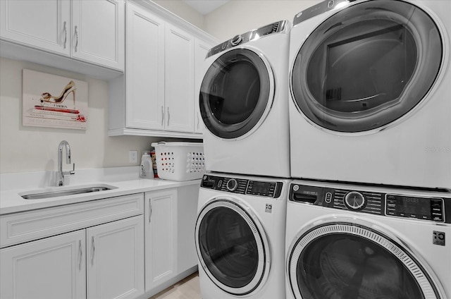 washroom featuring independent washer and dryer, cabinets, stacked washer / drying machine, and sink