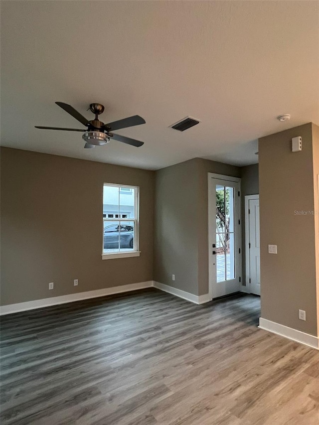 unfurnished room with wood-type flooring and ceiling fan