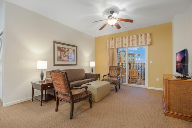 living room with light colored carpet and ceiling fan