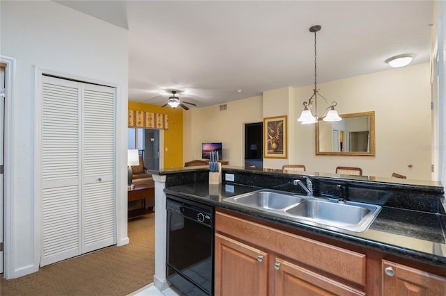 kitchen featuring ceiling fan with notable chandelier, dishwasher, light carpet, sink, and hanging light fixtures