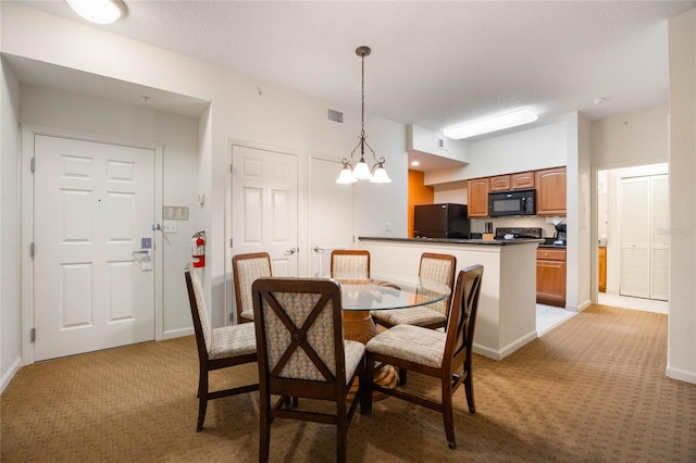 view of carpeted dining space