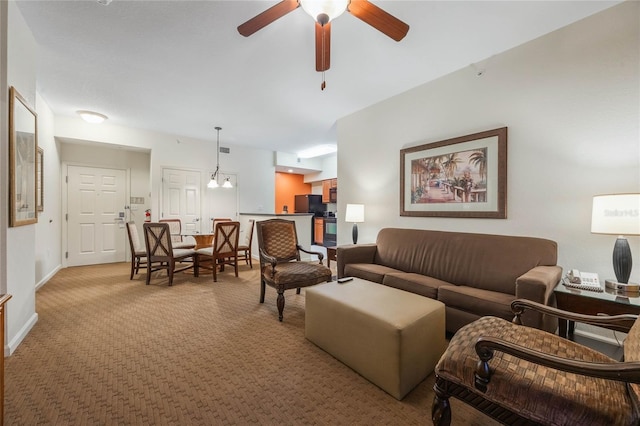 living room with ceiling fan and light carpet