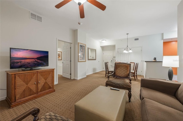 carpeted living room featuring ceiling fan