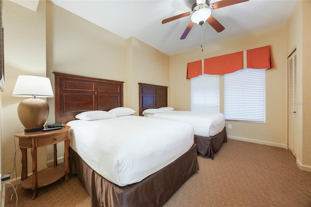 bedroom featuring a closet, ceiling fan, and carpet floors