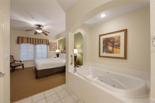 interior space with ceiling fan and light tile patterned flooring