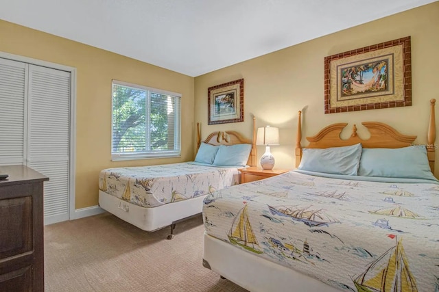 carpeted bedroom with a closet