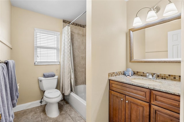 full bath featuring toilet, shower / tub combo, vanity, baseboards, and tile patterned floors