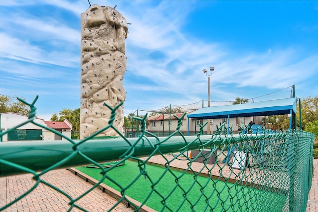 view of property's community featuring fence