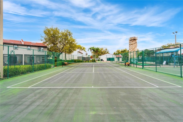 view of sport court with community basketball court and fence
