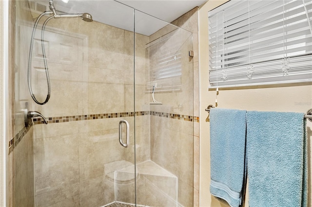 bathroom with a stall shower