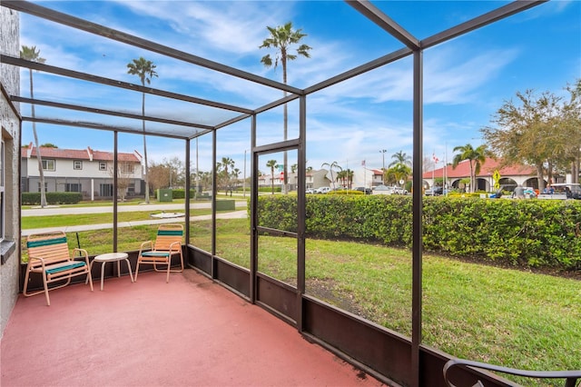 unfurnished sunroom with a residential view