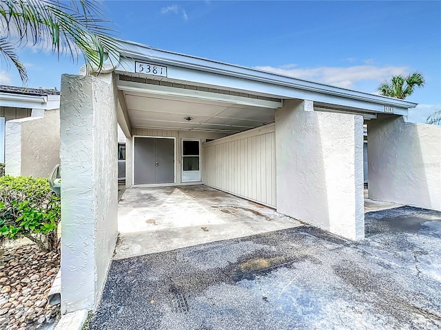 view of parking featuring a carport