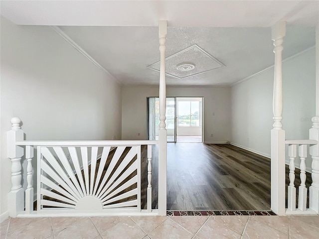 tiled spare room with crown molding and a textured ceiling