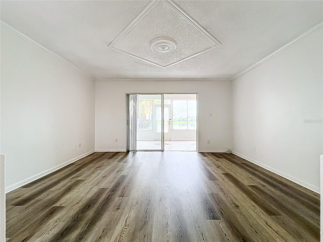 unfurnished room with dark wood-type flooring, a textured ceiling, and crown molding