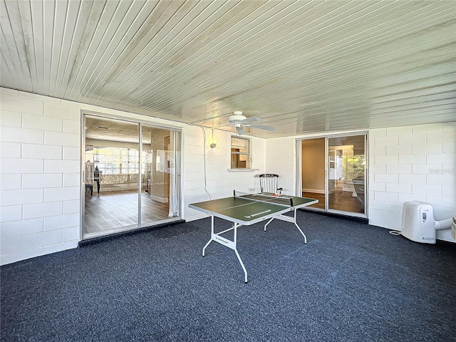 game room featuring dark colored carpet