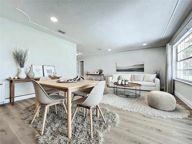 dining area with visible vents, wood finished floors, and recessed lighting