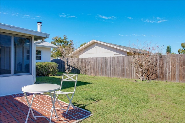 view of yard featuring a patio and fence