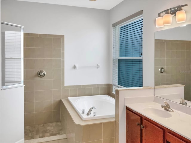 bathroom with tile patterned floors, vanity, and plus walk in shower