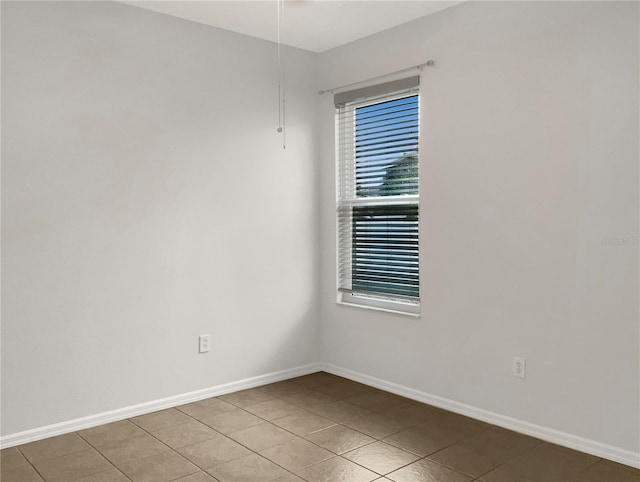 empty room with light tile patterned floors