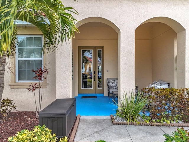 doorway to property with a patio area