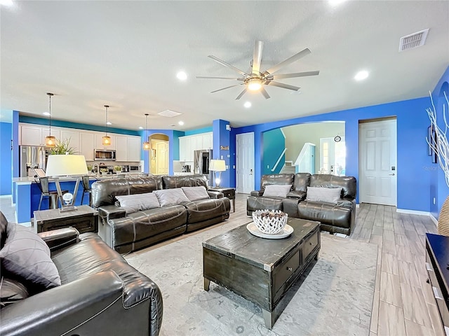 living room with ceiling fan