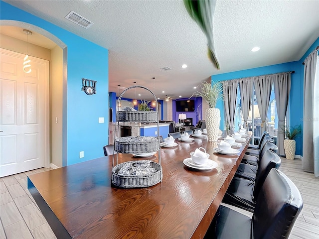 dining area with a textured ceiling