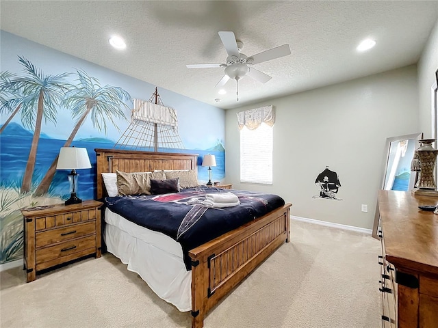 carpeted bedroom with ceiling fan and a textured ceiling