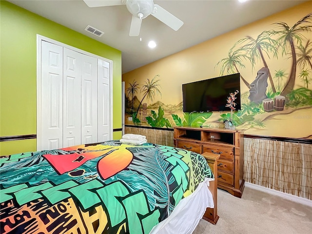 bedroom featuring a closet, ceiling fan, and light colored carpet