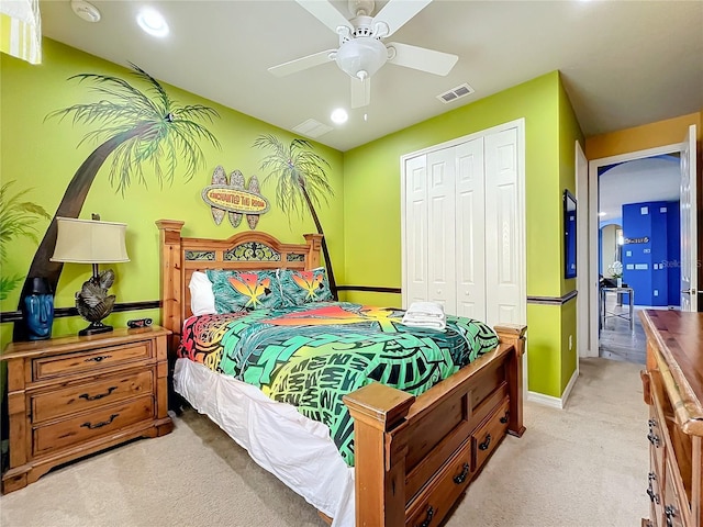 carpeted bedroom with a closet and ceiling fan