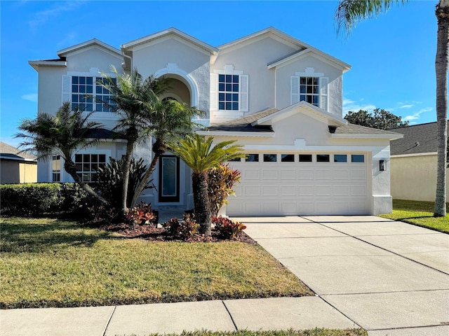 view of front of house with a garage and a front lawn