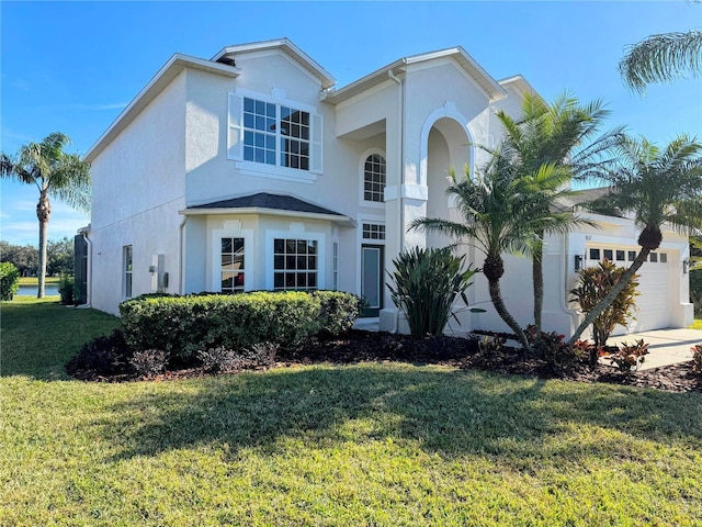 view of front facade with a garage and a front lawn