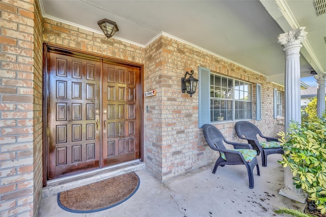 doorway to property with a porch