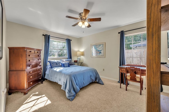 bedroom with light colored carpet and ceiling fan