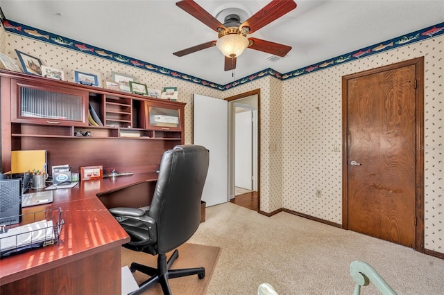 carpeted office with ceiling fan