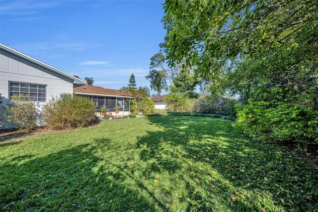 view of yard featuring a sunroom