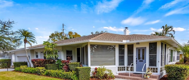 single story home featuring a garage