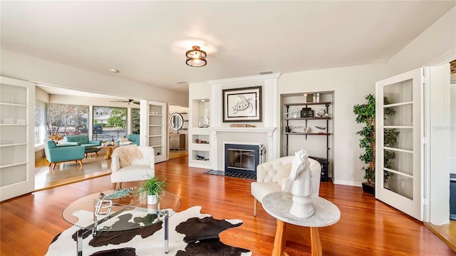 105 17th Ave NE, Saint Petersburg, FL 33704 - living room featuring wood finished floors, visible vents, a large fireplace, and ceiling fan