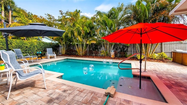 105 17th Ave NE, Saint Petersburg, FL 33704 - view of swimming pool featuring a fenced backyard, a patio, and a fenced in pool