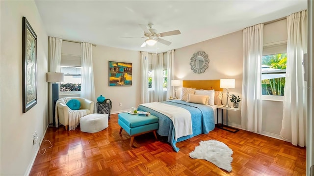 105 17th Ave NE, Saint Petersburg, FL 33704 - bedroom featuring ceiling fan, baseboards, and multiple windows