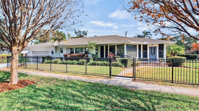 105 17th Ave NE, Saint Petersburg, FL 33704 - ranch-style home featuring a front lawn, a fenced front yard, a gate, driveway, and an attached garage
