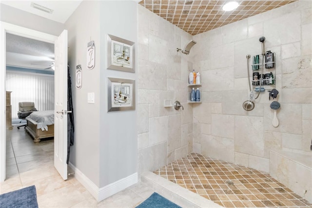 bathroom featuring a tile shower