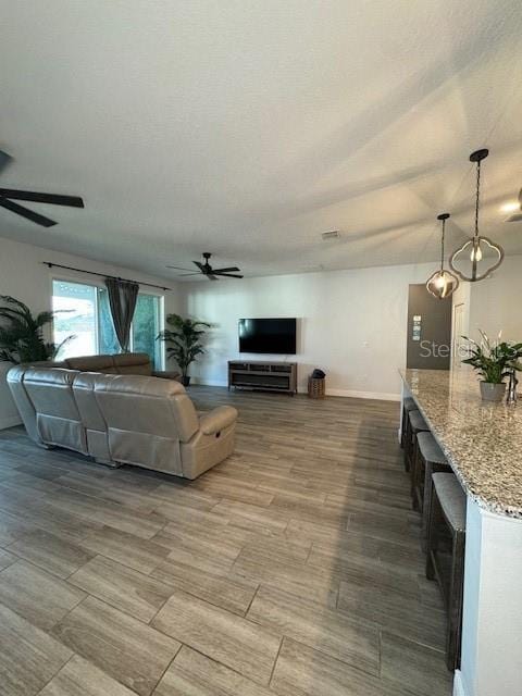 living room with ceiling fan