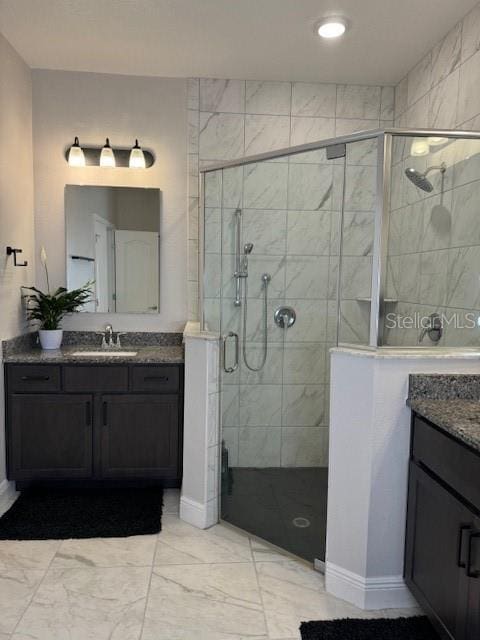 bathroom with vanity and an enclosed shower