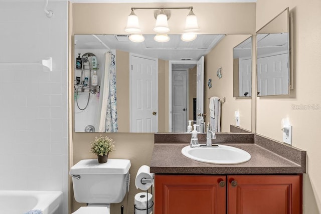 full bathroom with vanity, shower / tub combo, and toilet