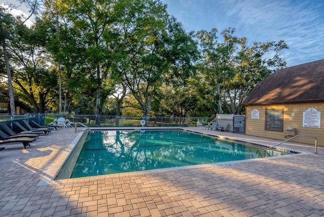 view of swimming pool featuring a patio area