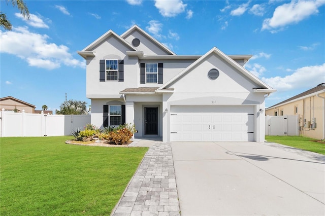 view of front of home featuring a garage and a front lawn