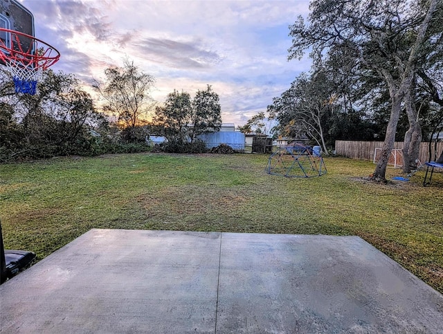 yard at dusk with a patio